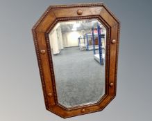 An Edwardian oak octagonal mirror,