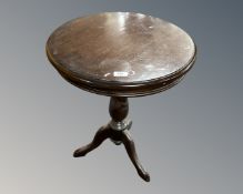 A tripod occasional table
