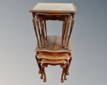 A mahogany glass topped nest of tables and a beech wood nest of tables (2)