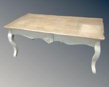 A French style coffee table on cabriole legs,