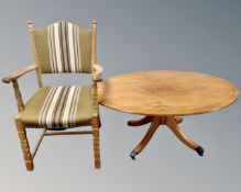 A yew wood oval coffee table together with a continental blonde oak dining chair.