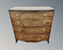 A late George III mahogany bow fronted chest of four drawers.