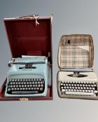 An Olivetti Studio 44 typewriter in case and an Adler typewriter in case.