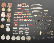 A quantity of military insignia including group of Pakistan Independence Medals,