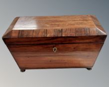 A 19th century rosewood sarcophagus tea caddy.