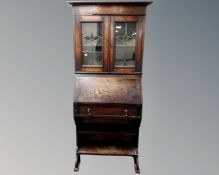 An Edwardian Arts & Crafts oak lady's bureau bookcase,