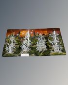 A set of four Oriental lacquered panels.