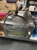 A stainless steel commercial microwave.