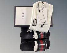 A pair of child's Gucci sliders size 33