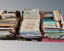 Three boxes of maritime books.