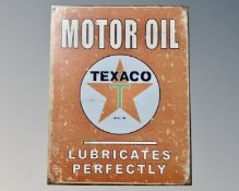A reproduction Texaco sign.