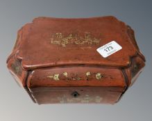 A late 19th century Chinese red lacquered tea caddy.