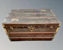 A wood and canvas travel trunk.