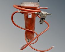 A sandblaster together with other tools including bolt cutters etc.