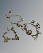 Three silver charm bracelets, 106g.