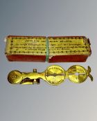 A set of antique sovereign scales in original box.