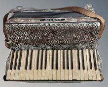 A Hohner Tango IV piano accordion. CONDITION REPORT: Some losses.