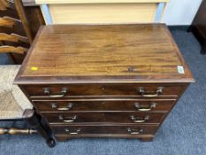 A Georgian style mahogany four drawer chest.