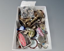 A small box containing a pair of brass candlesticks, brass compass,