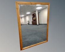 A contemporary pine overmantel mirror.
