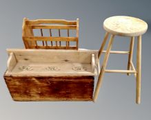 A magazine rack, bar stool,