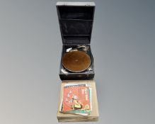An early 20th century gramophone and a small quantity of records.