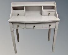 A painted writing desk fitted five drawers,