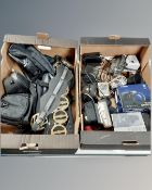 Two boxes containing cameras in bags, horse brasses etc.
