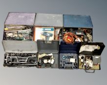 A box of boxed tools including Black & Decker drill and heat gun, Bosch sander etc.