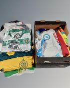 A box and tray containing assorted football shirts and flags.