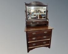 An Edwardian mirrorback dressing chest.