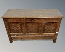 A George III carved oak coffer.