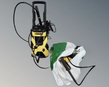 A Karcher K 3.575 pressure washer with various accessories.