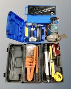 A box containing boxed and unboxed tools, Black & Decker grinder, Draper air nailer etc.