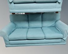 A three seater bed settee in light blue upholstery,