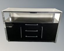 A contemporary sideboard fitted with cupboards and drawers.