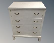 A continental painted pine chest of four drawers.