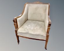A late Victorian inlaid rosewood armchair,