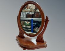 A Victorian style mahogany dressing table mirror.
