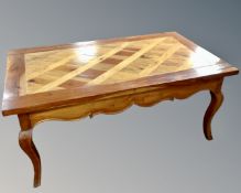 A stained pine rectangular coffee table,
