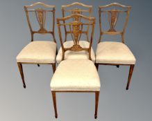A set of four late Victorian inlaid rosewood dining chairs.