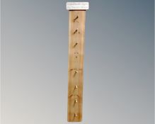 An Austin Sloan pine hat and coat rack