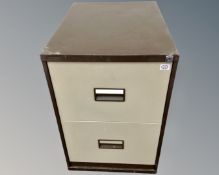 A Triumph two drawer metal filing cabinet.