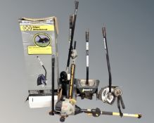 A lawn edger in box together with further garden tools.