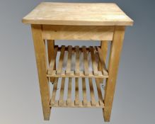 A pine butcher's block trolley.