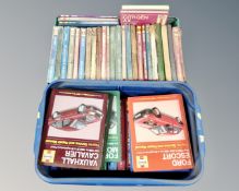 Two crates containing Haynes car manuals.