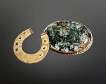 A 9ct gold horse shoe shaped brooch and a further brooch in 9ct gold mount