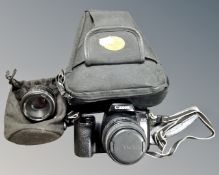 A Canon EOS 1000F autofocus SLR camera in case with Nikor 50mm f/1.8 lens and Sigma 35-80mm f/4-5.