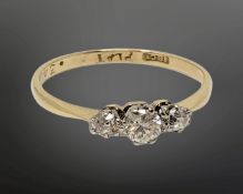 An 18ct gold three stone diamond ring, size O CONDITION REPORT: 1.