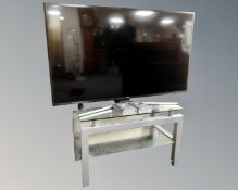 A Samsung LCD TV on stand.